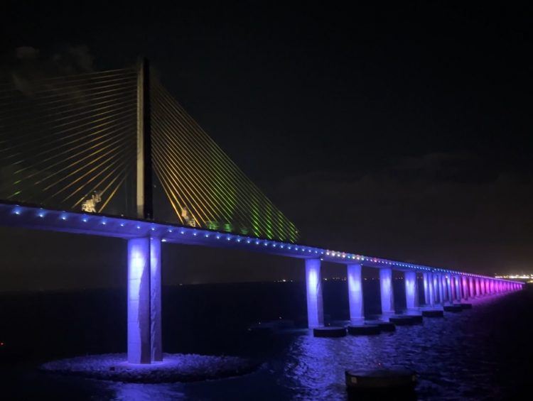 Cruise Ports - Carnival Pride Passes Under the Sunshine Skyway Bridge After Dark While Leaving Tampa
